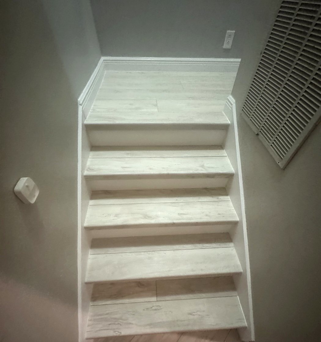 Finished oak staircase with white risers